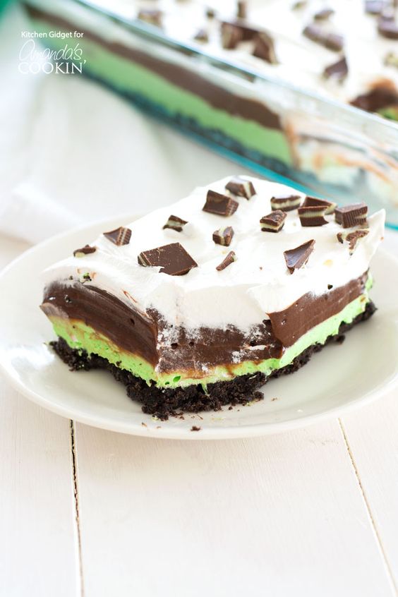 Mint Chocolate Lasagna is a no-bake, one-pan dessert with layers of mint cream cheese, chocolate pudding and Cool Whip on an Oreo crust. Great for St. Patrick's Day dessert.